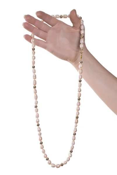 Collar de perlas rosadas en la mano —  Fotos de Stock