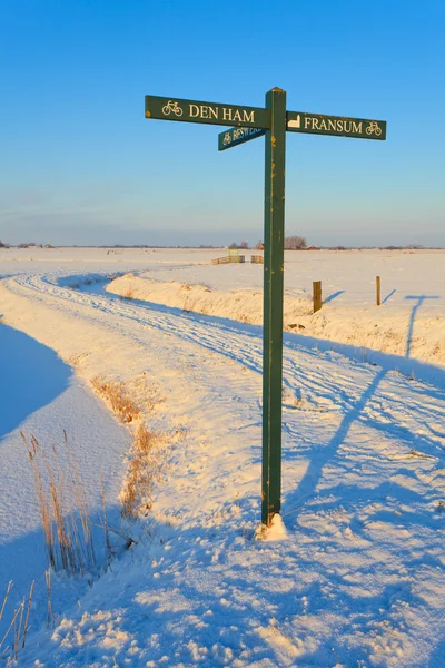 Road sign in winter landscape — Stock Photo, Image