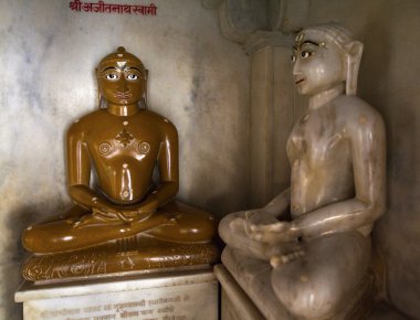 BUDDHAS IN ADINATHA TEMPLE - A JAIN TEMPLE IN RANAKPUR (RAJASTHAN - INDIA) clipart