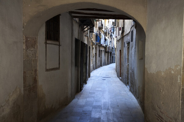 A quiet medieval street with laundry, in the center of Barcelona (Spain).