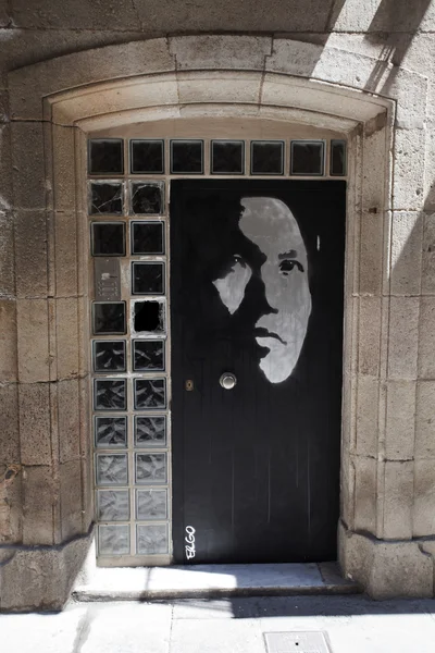 Door painting of a man face in Barcelona — Stock Photo, Image