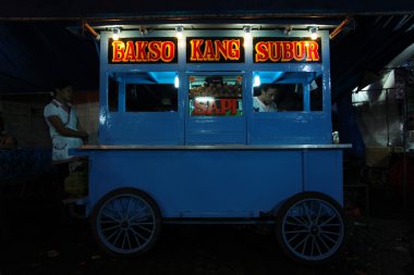 A SHOP AT THE NIGHT MARKET (PASAR MALAM) IN BALI clipart