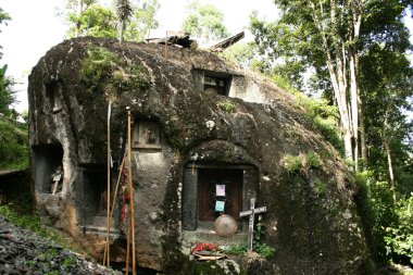 Grave in a rock in Tana Toraja - Sulawesi Indonesia clipart