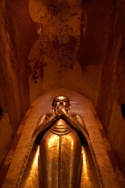 Statue of golden buddha in Ananda Pahto temple in Bagan - Myanmar (Burma) clipart