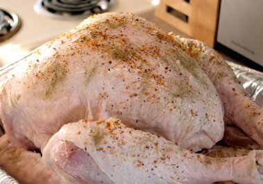 Seasoned uncooked turkey - ready for roasting clipart