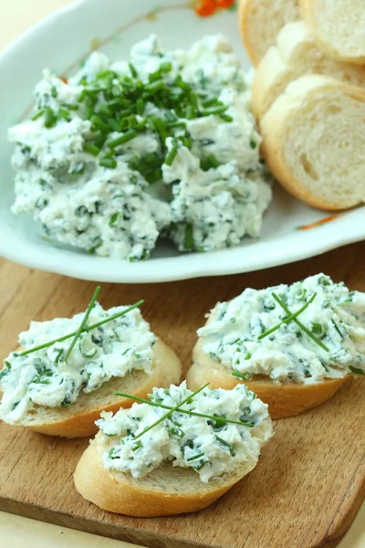 Baguette with spread from chives — Stock Photo, Image