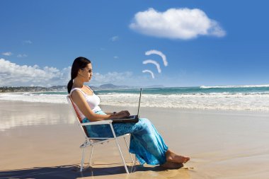 Casual Worker works with laptop at beach clipart