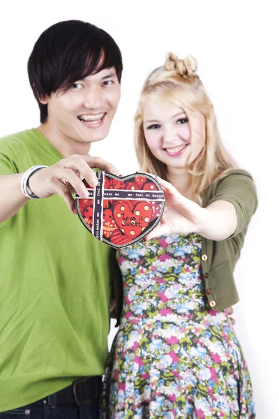 Couple holding a heart shaped box — Stock Photo, Image