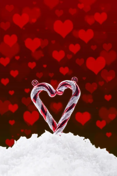 Christmas background with snow and hearts — Stock Photo, Image