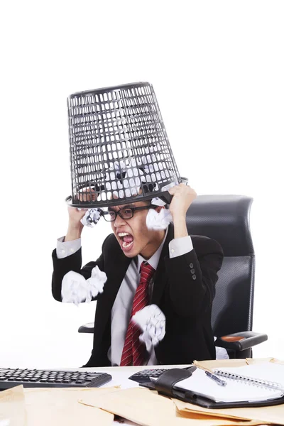 Angry businessman with rubbish bin on his head — Stock Photo, Image