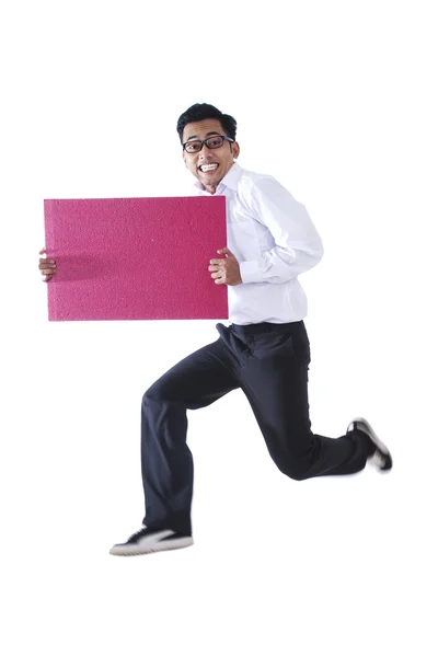 Happy businessman with a blank sign — Stock Photo, Image