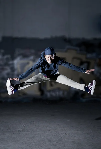 Cool Asian man jumping while dancing — Stock Photo, Image