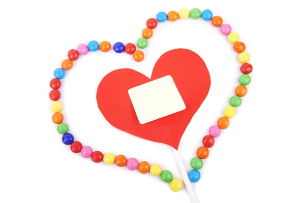 Coração com espaço de cópia emoldurado com doces coloridos — Fotografia de Stock