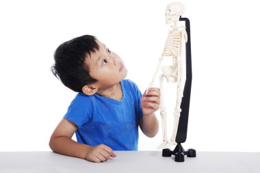 Asian boy with human skeleton clipart