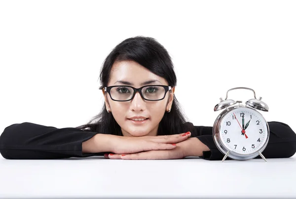 Beautiful businesswoman with alarm clock — Stock Photo, Image