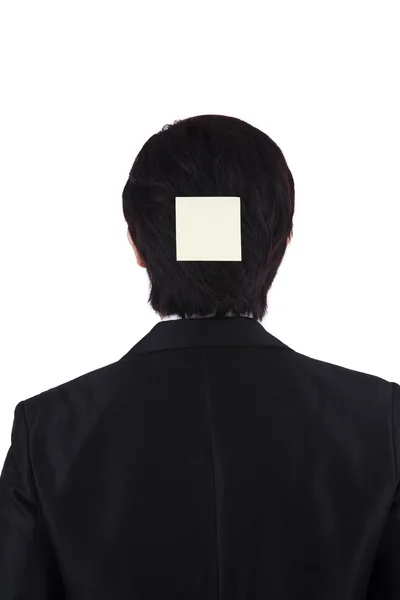 Uomo d'affari con blocco note sulla testa posteriore — Foto Stock