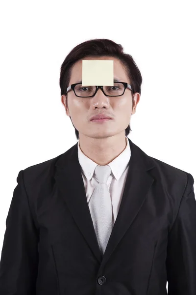 Businessman with sticky on his head — Stock Photo, Image