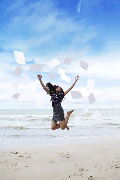 Woman jumps with paperwork — Stock Photo, Image