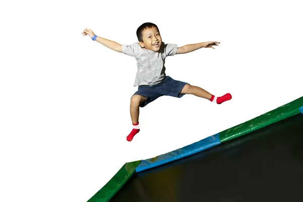 Menino feliz pulando em branco — Fotografia de Stock