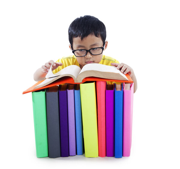 Asian kid with books isolated on white