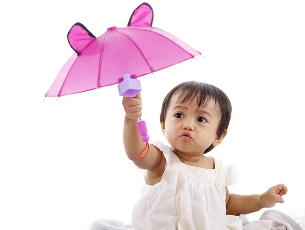 Leuk meisje met roze paraplu — Stockfoto
