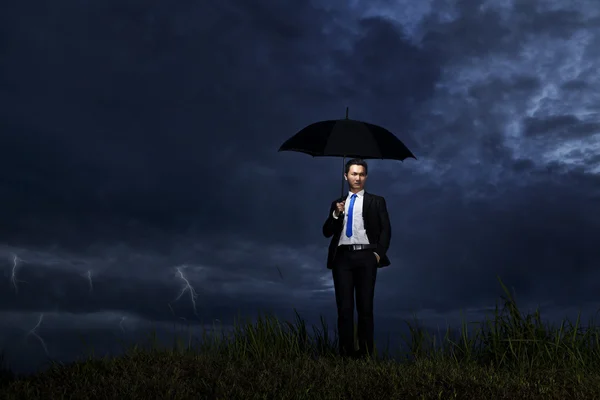 Businessman with thunderstorm — Stock Photo, Image