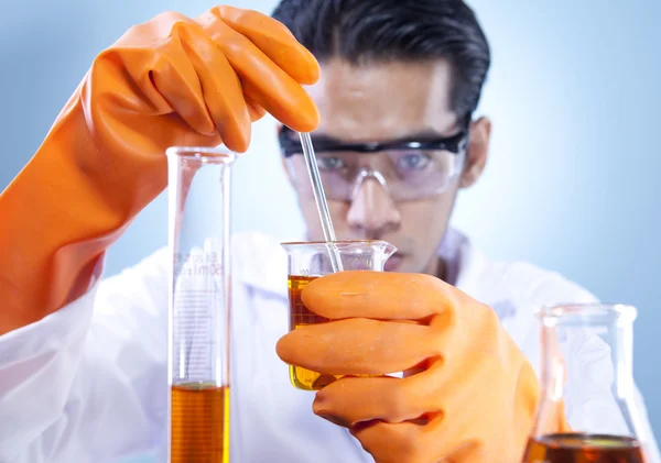 Mixing chemical in laboratory Royalty Free Stock Photos
