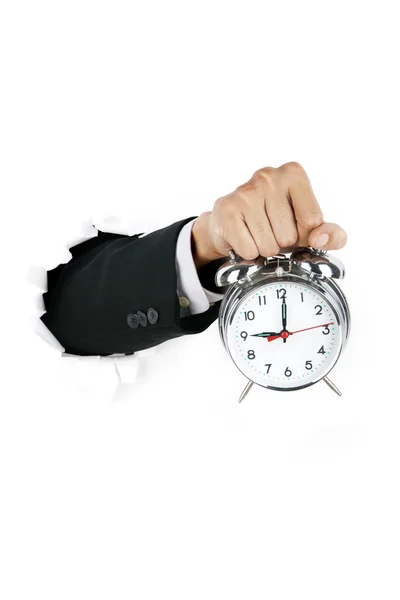Empresário segurando um relógio alarmante — Fotografia de Stock