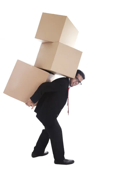 Businessman carrying boxes — Stock Photo, Image