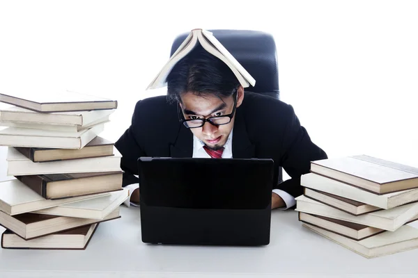 Businessman in library — Stock Photo, Image