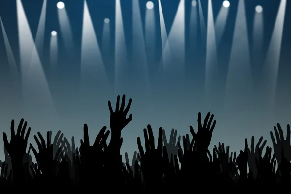 Manos arriba siluetas en un concierto — Foto de Stock