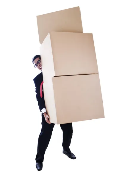 Бизнесмен с тяжелыми коробками — стоковое фото
