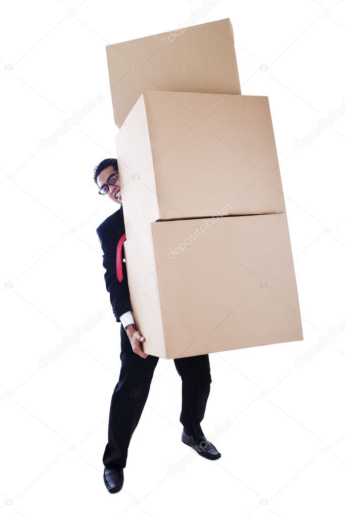 Businessman carrying heavy boxes