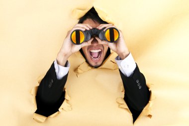 Shocked businessman with binoculars clipart