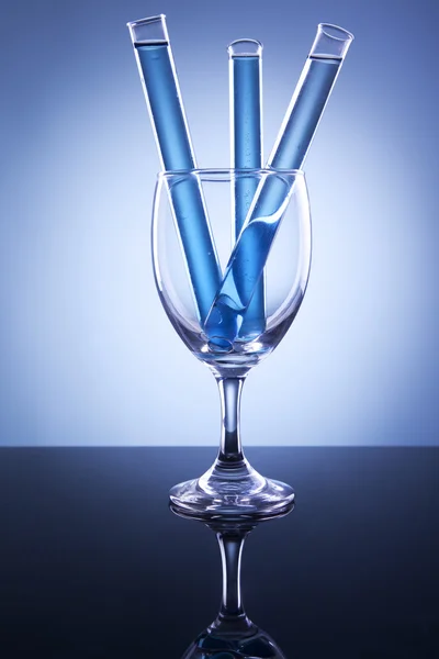 Test tube with glass — Stockfoto