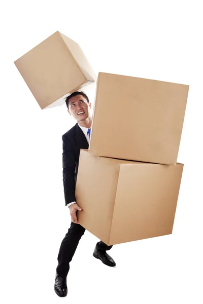 Asian businessman carrying boxes — Stock Photo, Image