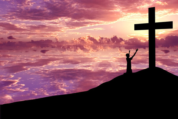 Silhouette of a man Praising Jesus