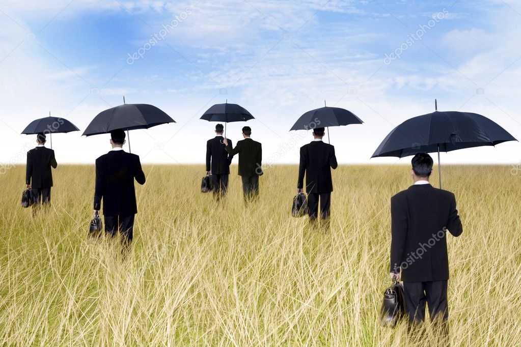 Businessmen with umbrella outdoor