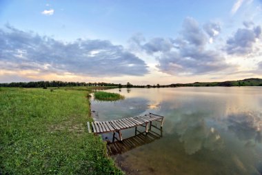 Lake, wood bridge, sunset clipart