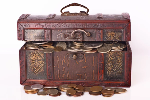 Wooden chest with coins inside — Stock Photo, Image