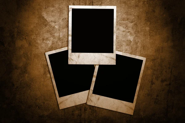 Aged photo frames on grunge background — Stock Photo, Image