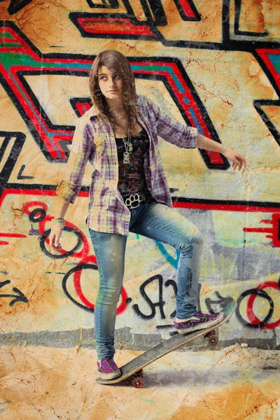 stock image Pretty skater girl standing on skateboard