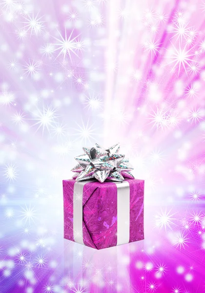 Gift box against glowing background — Stock Photo, Image