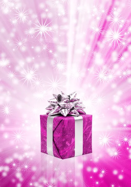 Gift box against glowing background — Stock Photo, Image