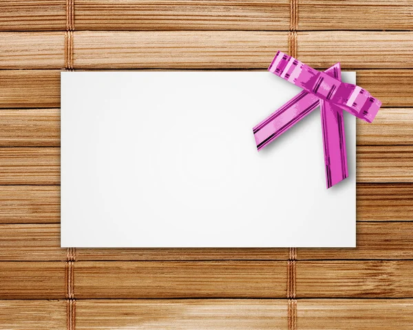 Blank postcard tied with a bow — Stock Photo, Image