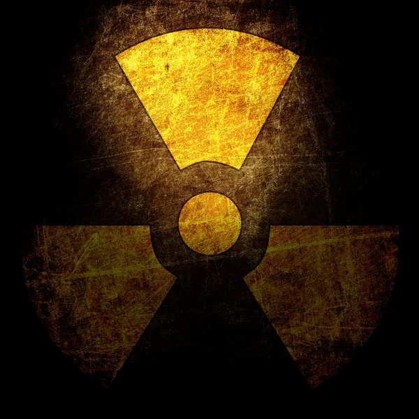 Teken van straling op de muur grunge — Stockfoto
