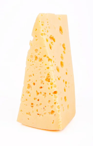 Pedazo de queso sobre un fondo blanco — Foto de Stock