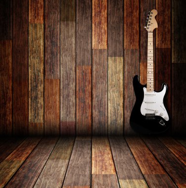 Electric guitar on the wooden room clipart