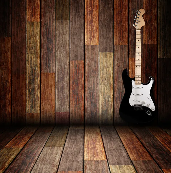 Guitarra elétrica na sala de madeira — Fotografia de Stock