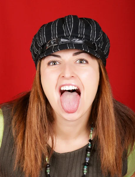 Young girl sticking out her tongue — Stock Photo, Image